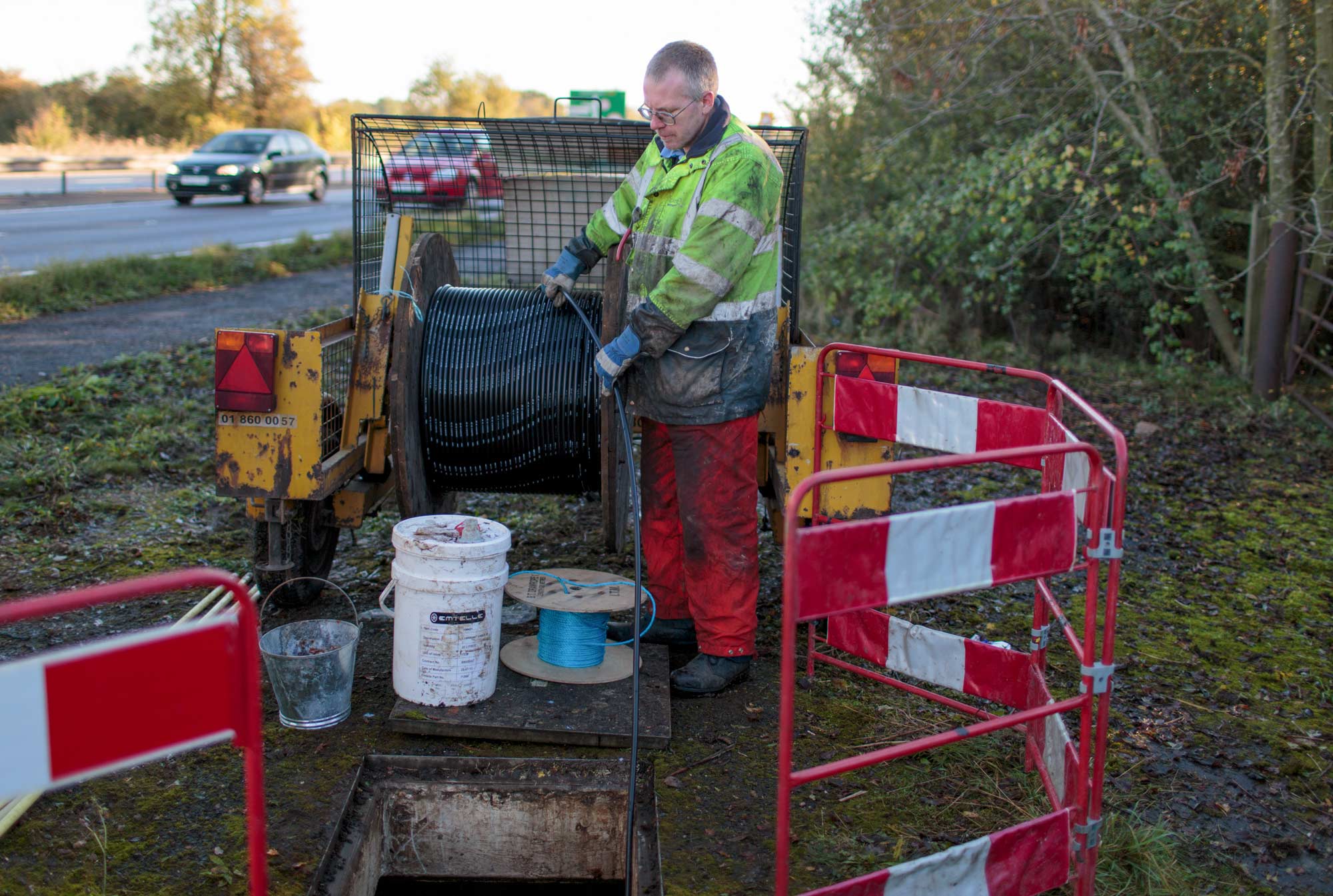 Openreach engineer laying fibre-optic cable